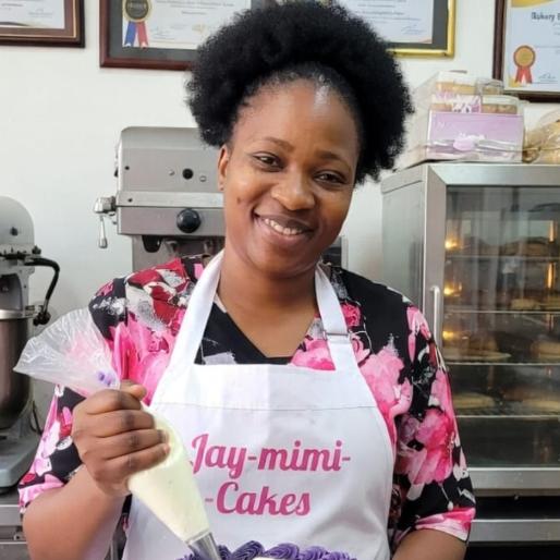 Jay-mimi-cakes founder smiling in the bakery